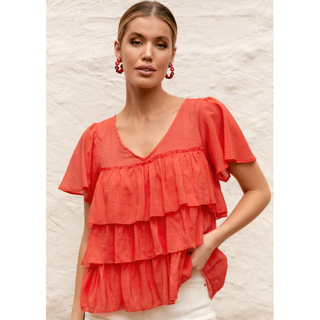 Easy to wear red women's top in a fabric mix of Bamboo/Cotton and Tencel you will make a memorable statement whatever the occasion. When you need to add a bit of Za Za to your outfit go dramatic in our striking Za Za Fril Top in red. Shop online now at Love Moi Boutique.